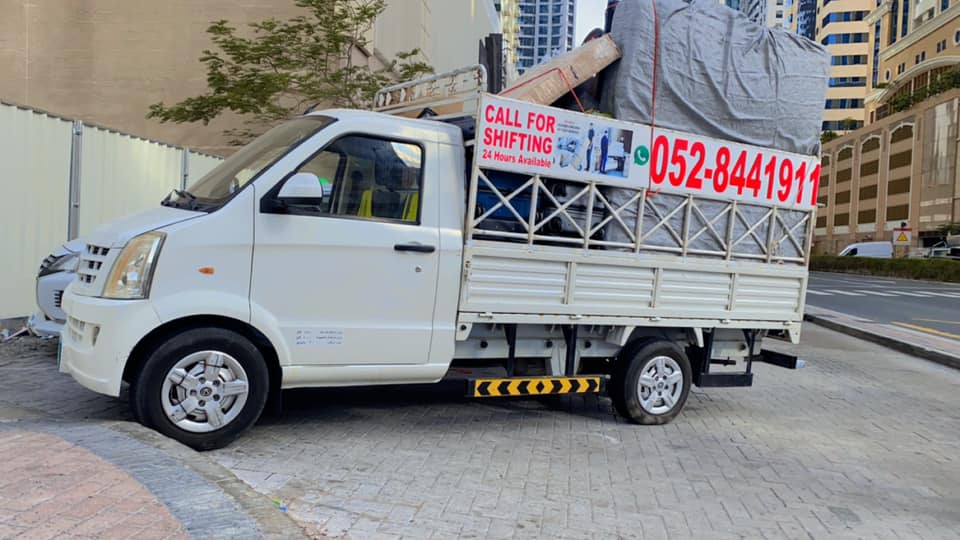 Expert packing team wrapping and packing household items Dubai