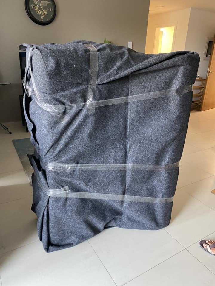 Faisal Movers team packing boxes professionally in Dubai